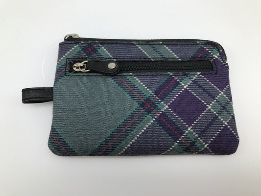Small tartan purse with zip on top edge and zipped outer pocket. Black trim. leather loop on left hand side.