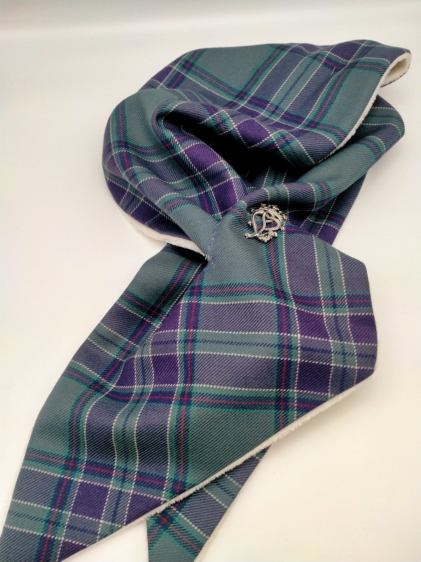 The scarf laid out flat.