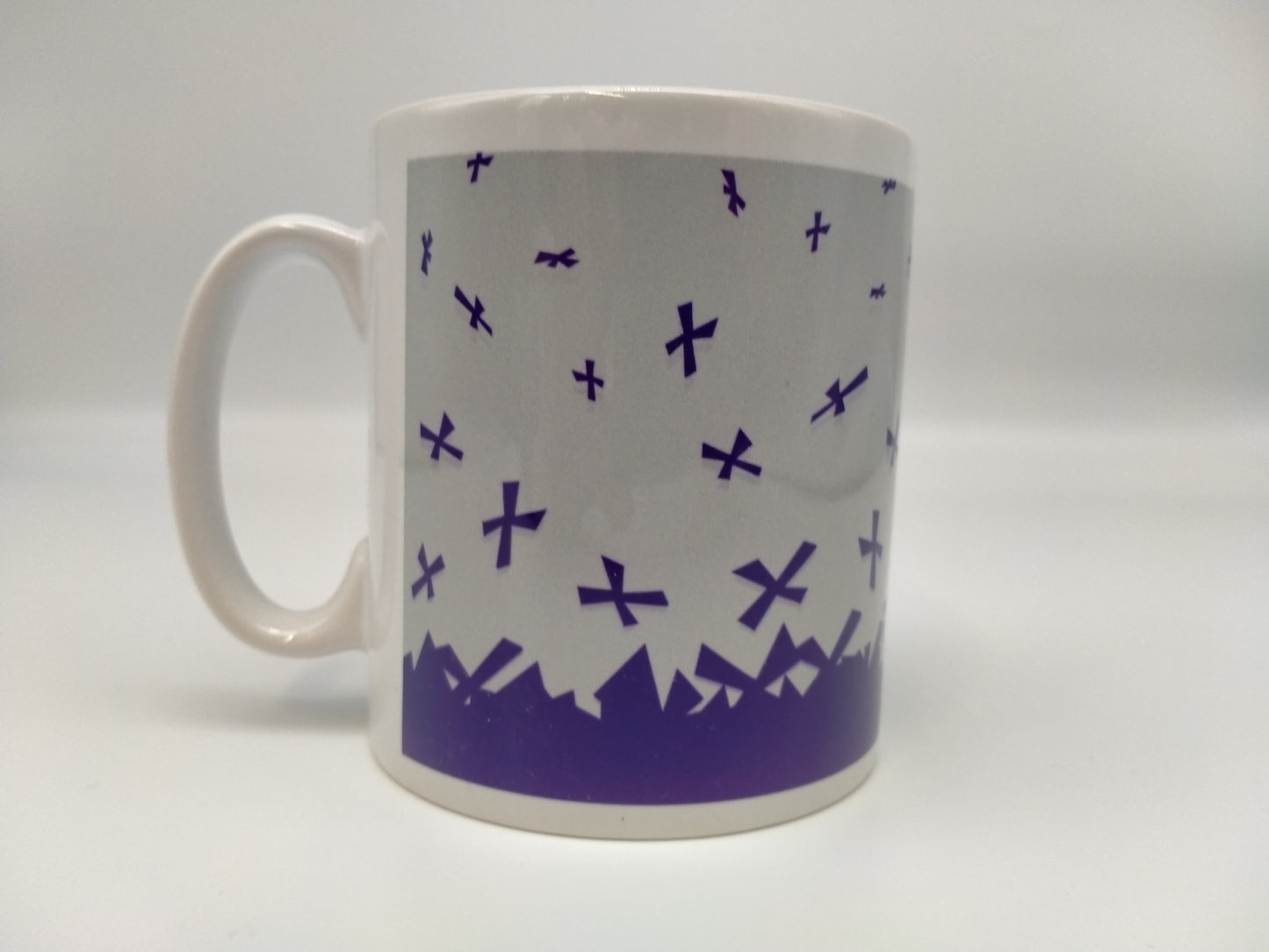 The back of the mug: purple saltires on gray background.