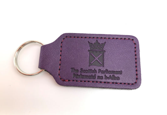 Purple leather key fob embossed with the symbol of the Scottish Parliament.