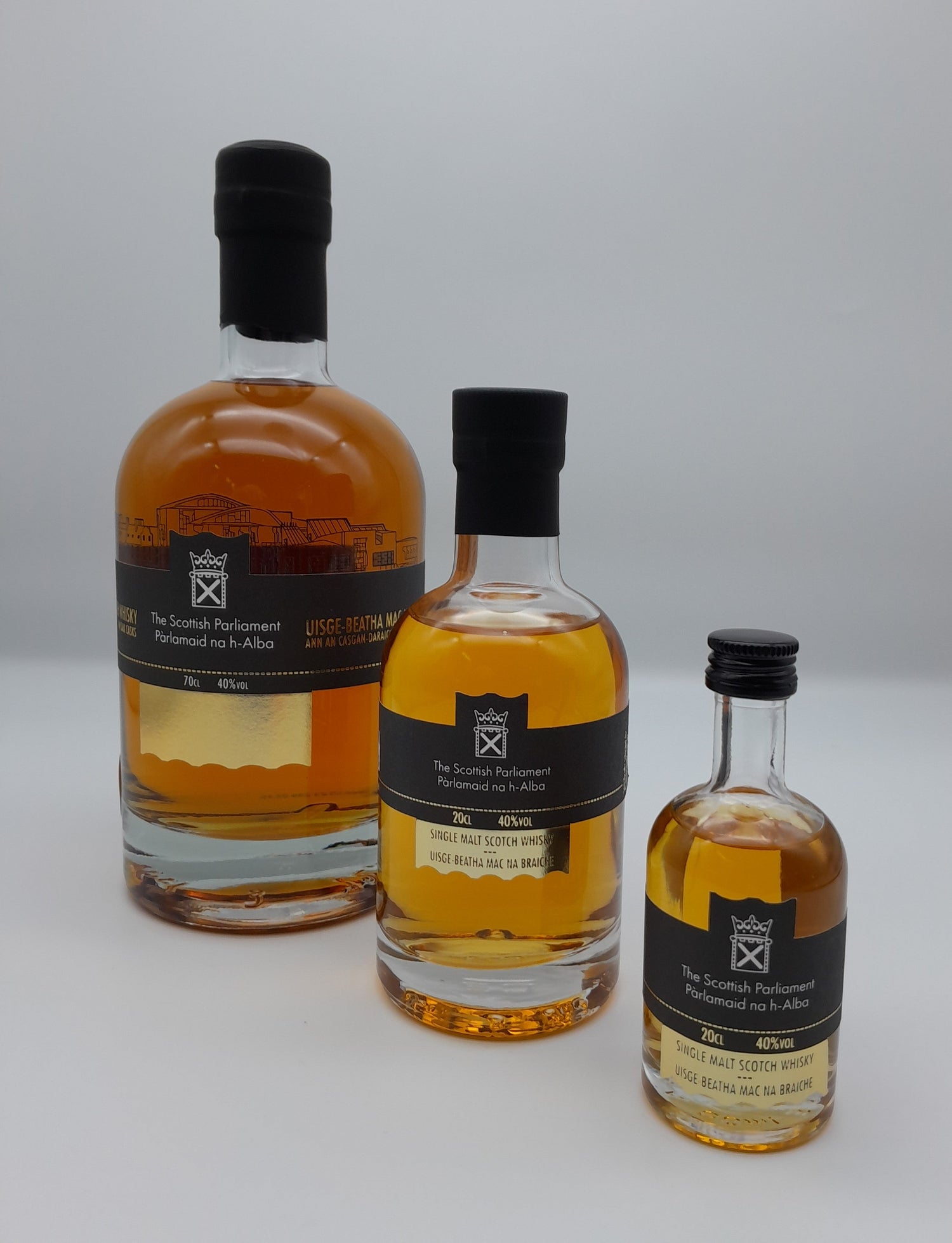 Three whisky bottles in different sizes