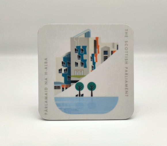 A square white cosater printed with an image of a part of the Scottish Parliament building. A contemporary design features some architectural details of the building, a pond and trees. Writing The Scottish Parlaiment in English and Gaelic.