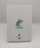 The back cover of the notebook - white with a miniature of the front image and the symbol of the Scottish Parliament. 