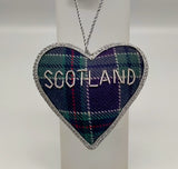The othr side of the tartan heart decoration embroidered with the word: Scotland.
