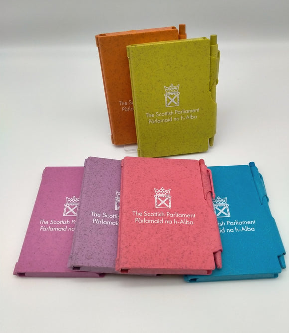 A display of six notebooks in various colours. 