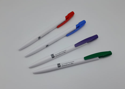 Four pens with different couloured tops and the symbol of the Scottish Parliament.