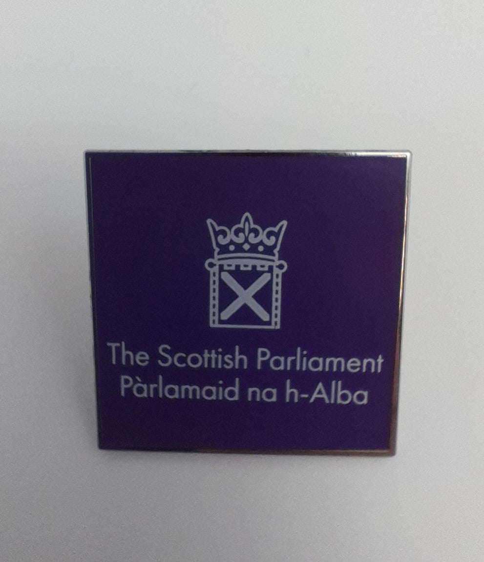 Square purple badge with the white symbol of the Scottish Parliament 