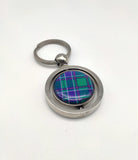 The keyring showing the other side of the spinning part decorated with the parliament tartan.