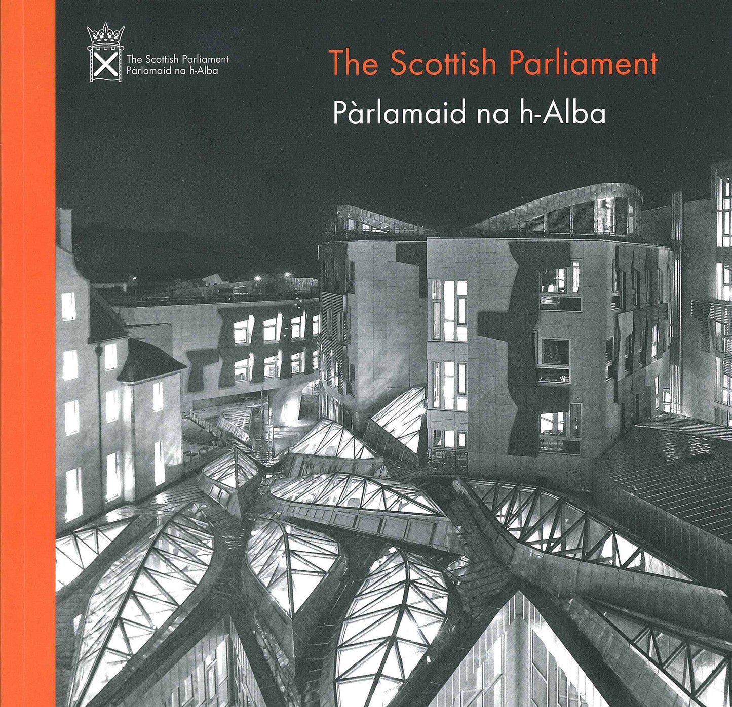 The front cover of the book - a black and white picture of the Parliament campus at night with an orange stripe at the side.