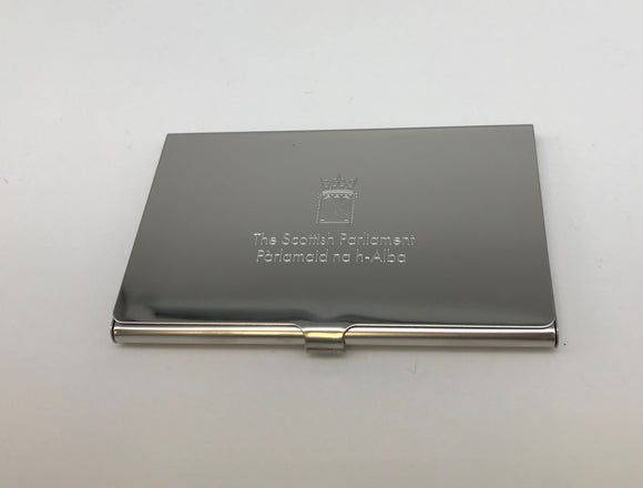 Silver plated card case with engraved symbol of the Scottish Parliament. Closed.