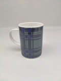 A mug with white handle printed in the Scottish Parliament tartan.