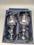 The goblets in their box which is lined with navy blue fabric.