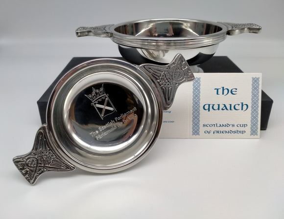 Medium and small quaichs with a card reading: The quaich, Scotland's cup of friendship.