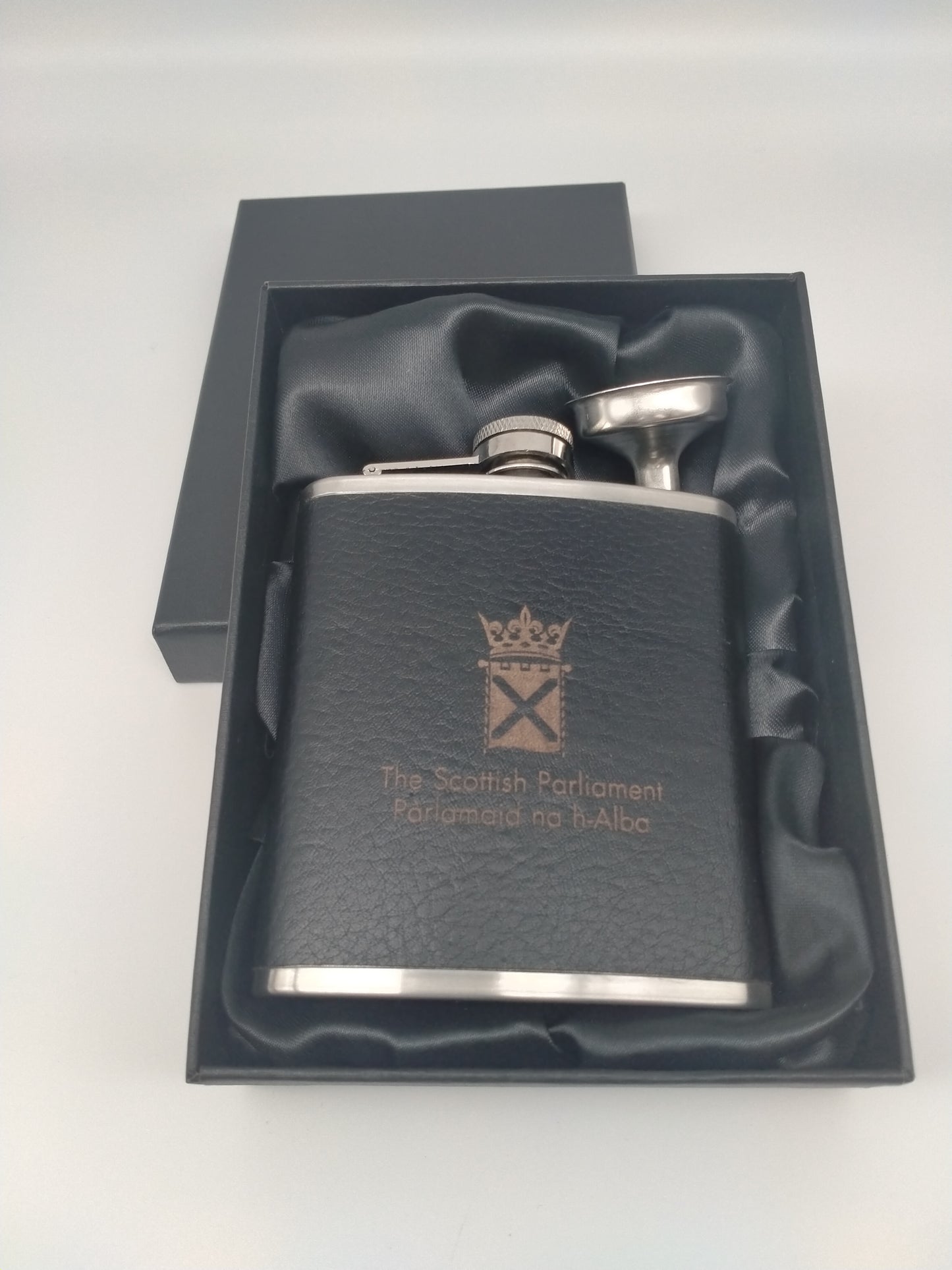 The flask in its box lined with black fabric.