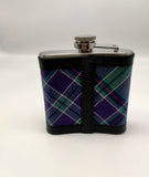 The back side of the flask with a vertical leather stripe.