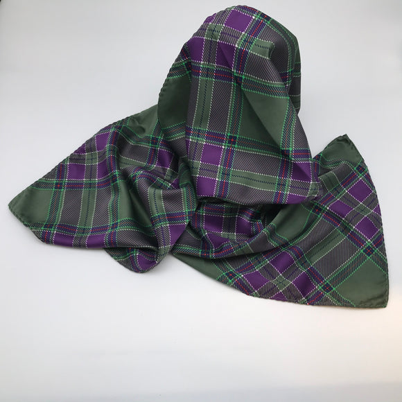 Tartan scarf draped over a stand