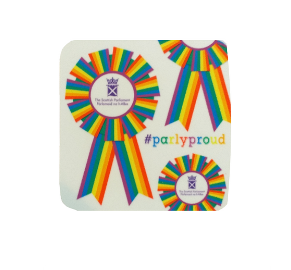 Square white coaster with multi-coloured rosettes printed on surface. The centre of each rosette features the symbol of the Parliament. Text reads #Parlyproud