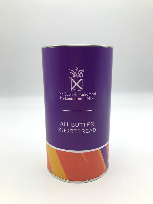 Cylindrical container with multi-coloured wrapper.  Scottish parliament symbol and words All Butter Shortbread