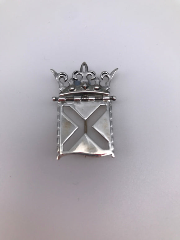 Silver brooch featuring the crown and saltire elements of the Parliament symbol