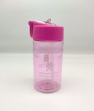 Transparent bottle tinted pink and decorated with the symbol of the Scottish Parliament. Lid is pink with a transparent pop-up spout.