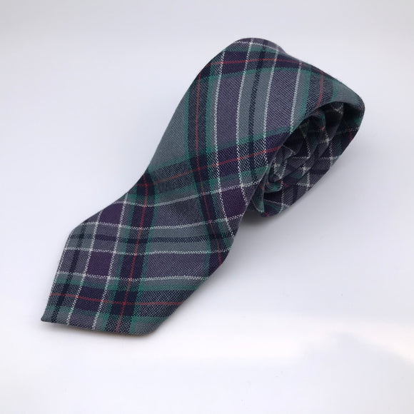 Rolled up woolen tie in the Scottish Parliament tartan.