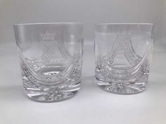 A pair of crystal whisky glasses engraved with the symbol of the Scottish Parliament.