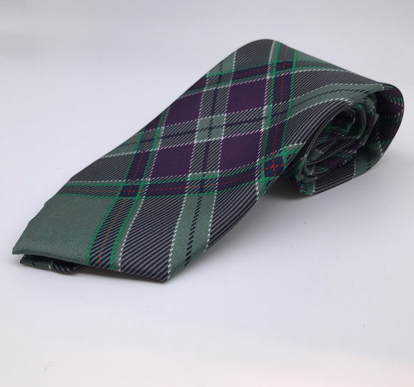 A rolled up silk tie in the Scottish Parliament tartan.