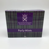 A box of mints printed in the Scottish Parliament tartan and with the symbol of the parliament. The writing on the box reads: Parly-Mints, 150g.