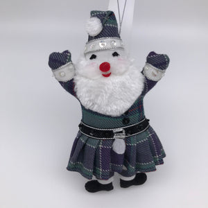 Santa with white beard and smiling face. Arms raised. Dressed in tartan outfit.