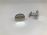 Pair of cufflinks. One pictured face on, the other shows the fitting
