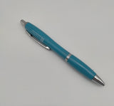 Blue pen decorated with the symbol of the Scottish Parliament with silver elements.