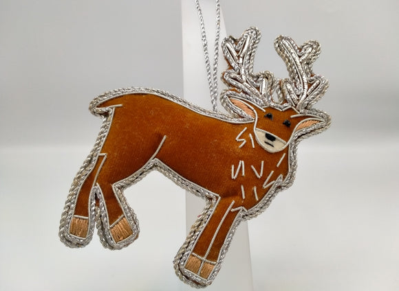 A stag decoration. Brown with silver stitching detail.
